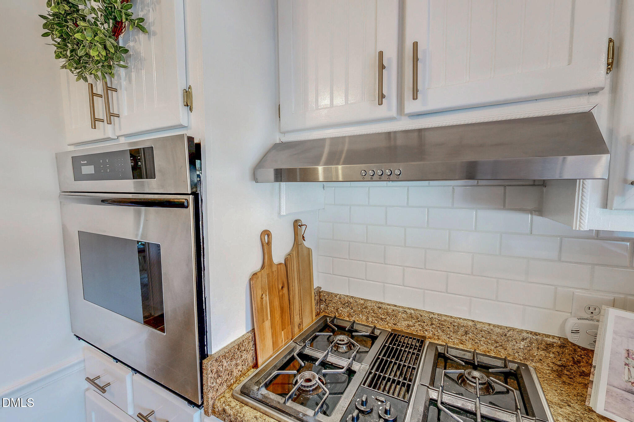 7810 Helena Moriah Road Rougemont, NC 27572 - Photo 11 of 53 a kitchen with granite countertop a stove and a microwave