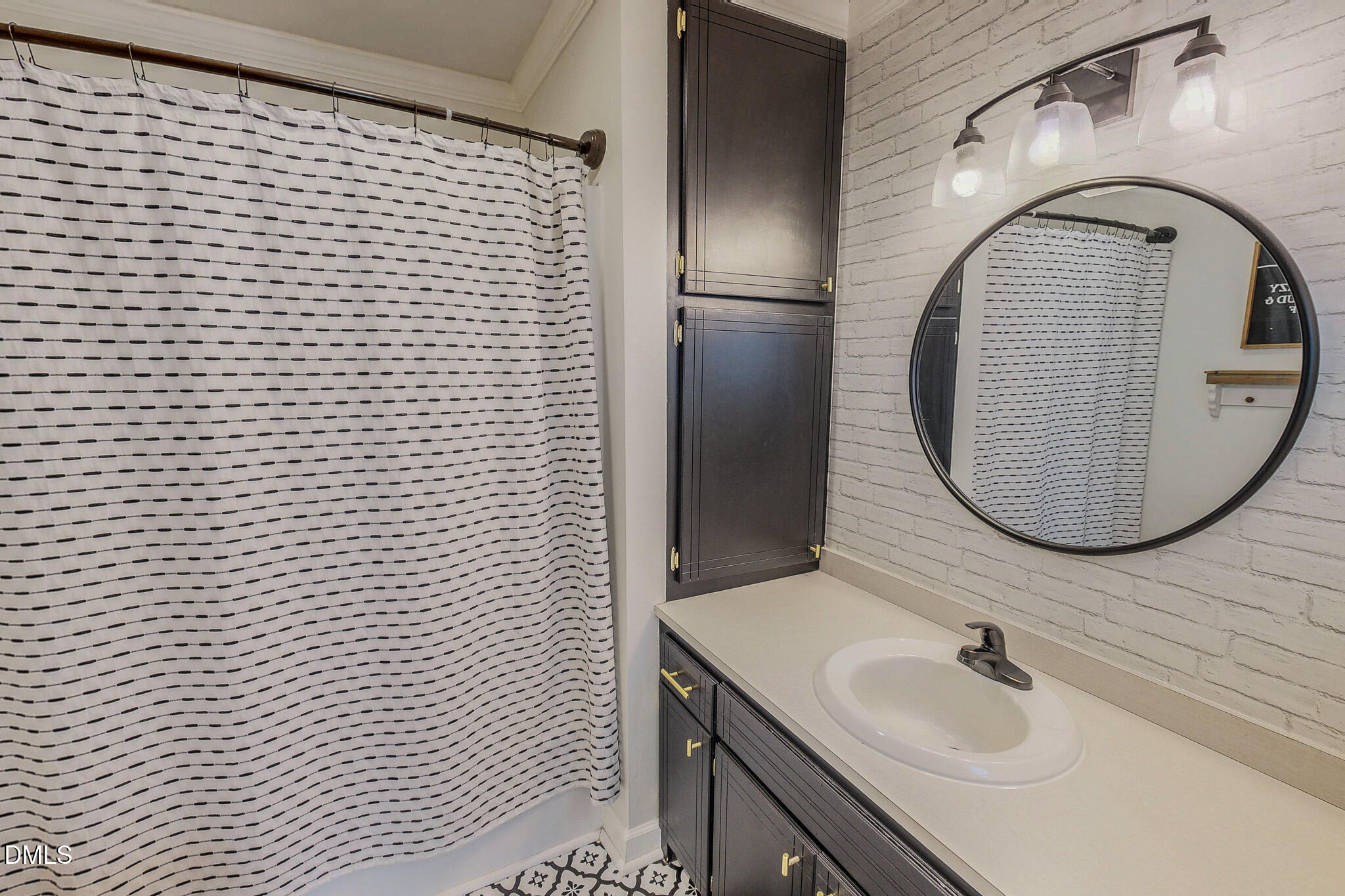 7810 Helena Moriah Road Rougemont, NC 27572 - Photo 37 of 53 a bathroom with a sink and a mirror