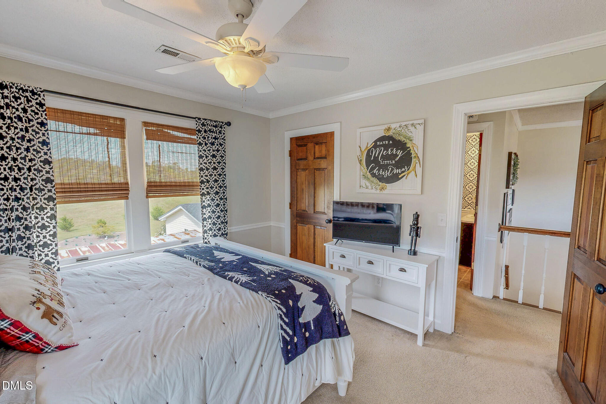 7810 Helena Moriah Road Rougemont, NC 27572 - Photo 40 of 53 a bedroom with a bed a dresser next to a window