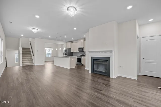 a view of kitchen with furniture and wooden floor