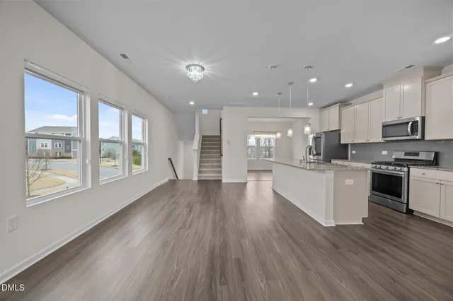 a view of kitchen with cabinets and wooden floor
