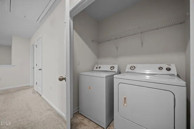 a view of storage and utility room with washer and dryer