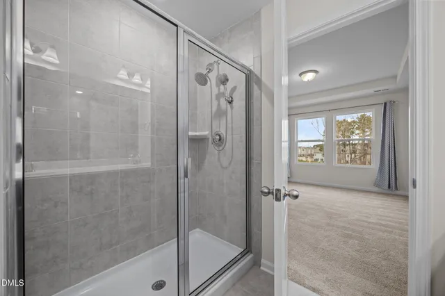 a bathroom with a shower and a sink