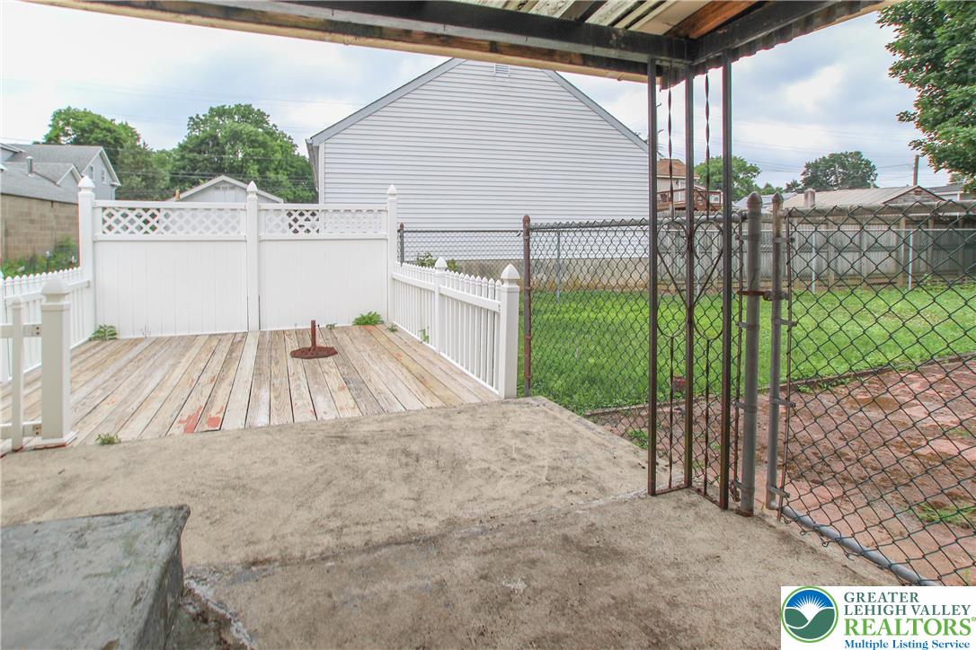 492 Filetown Road Nazareth, PA 18064 - Photo 30 of 30 A spacious backyard with a wooden deck offers ample room for outdoor activities.