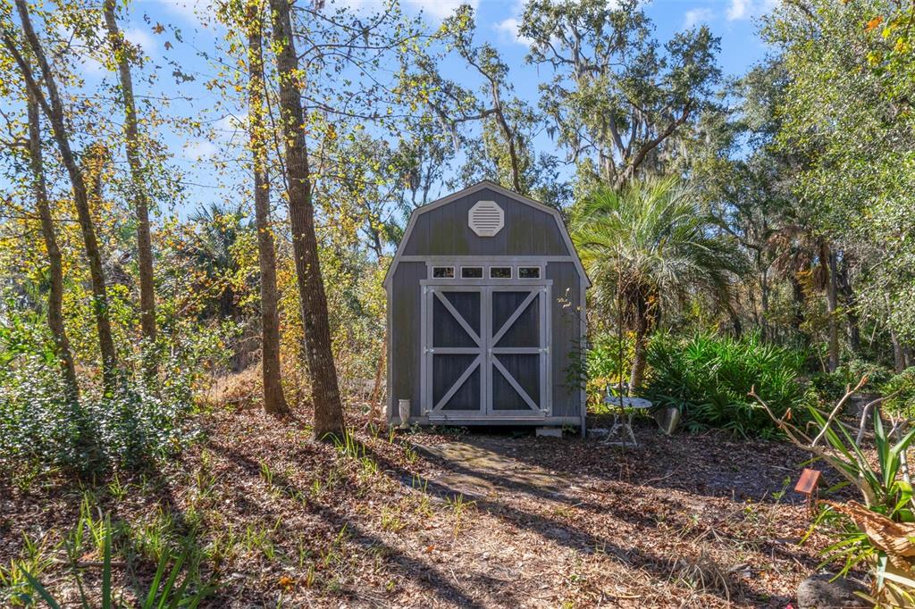 1239 St Anne Shrine Road Lake Wales, FL 33898 - Photo 20 of 27 a front view of a house with garden