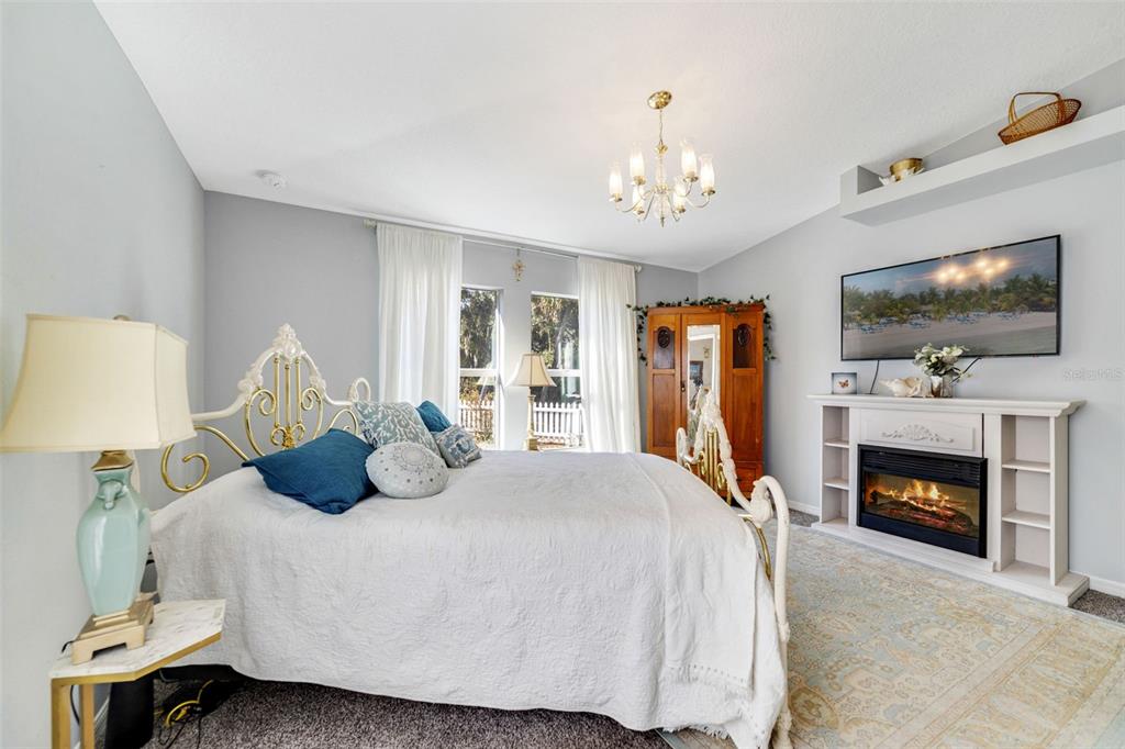 1239 St Anne Shrine Road Lake Wales, FL 33898 - Photo 7 of 27 a bedroom with a bed and a flat screen tv