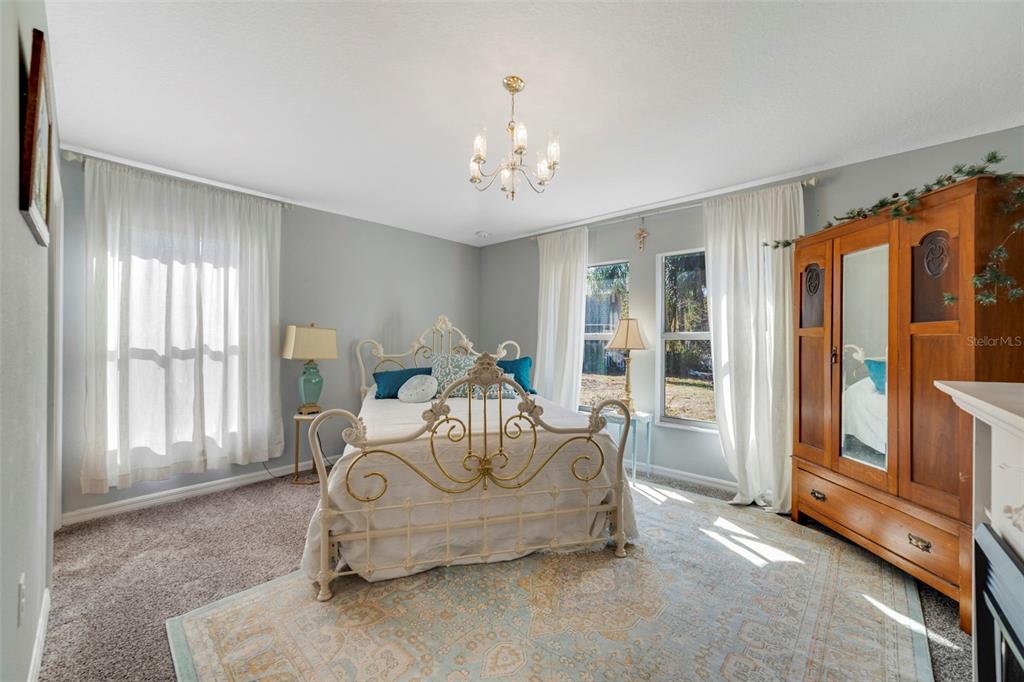 1239 St Anne Shrine Road Lake Wales, FL 33898 - Photo 8 of 27 a living room with furniture and a chandelier