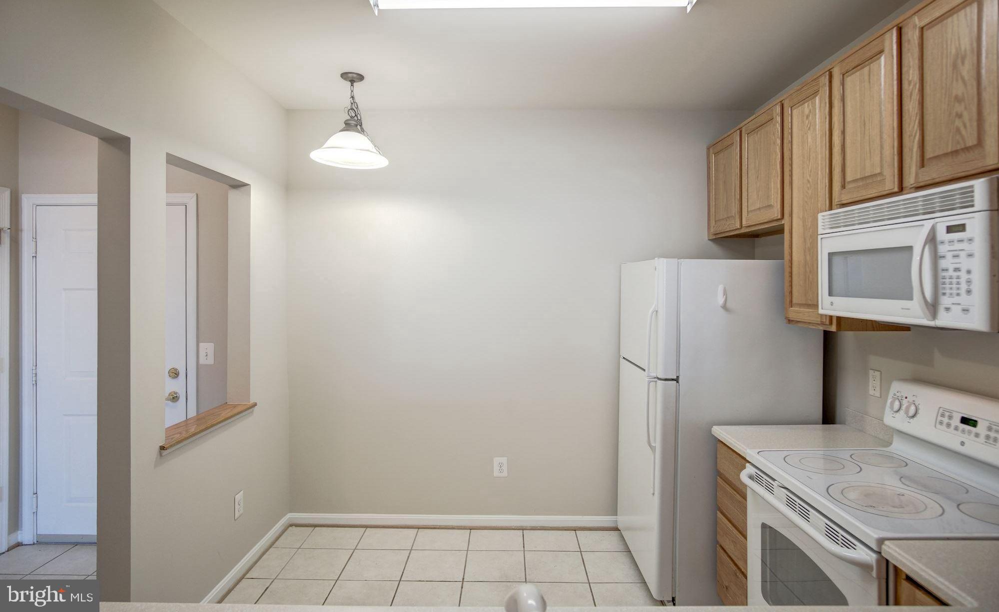 7325 Brookview Road, Unit 308 Elkridge, MD 21075 - Photo 6 of 31 Space for table in kitchen