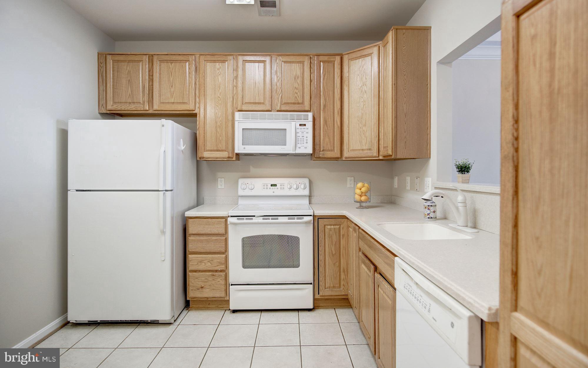 7325 Brookview Road, Unit 308 Elkridge, MD 21075 - Photo 7 of 31 Wood cabinetry in kitchen