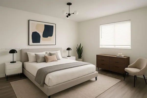 a bedroom with a bed and a couch