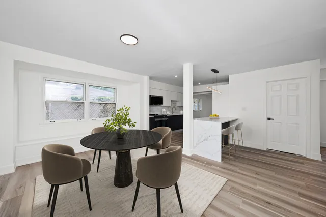 a dining room with furniture and window