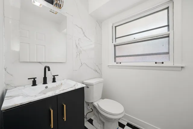 a bathroom with a sink and a toilet