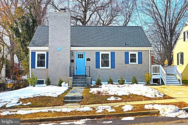 a view of a house with snow on the background