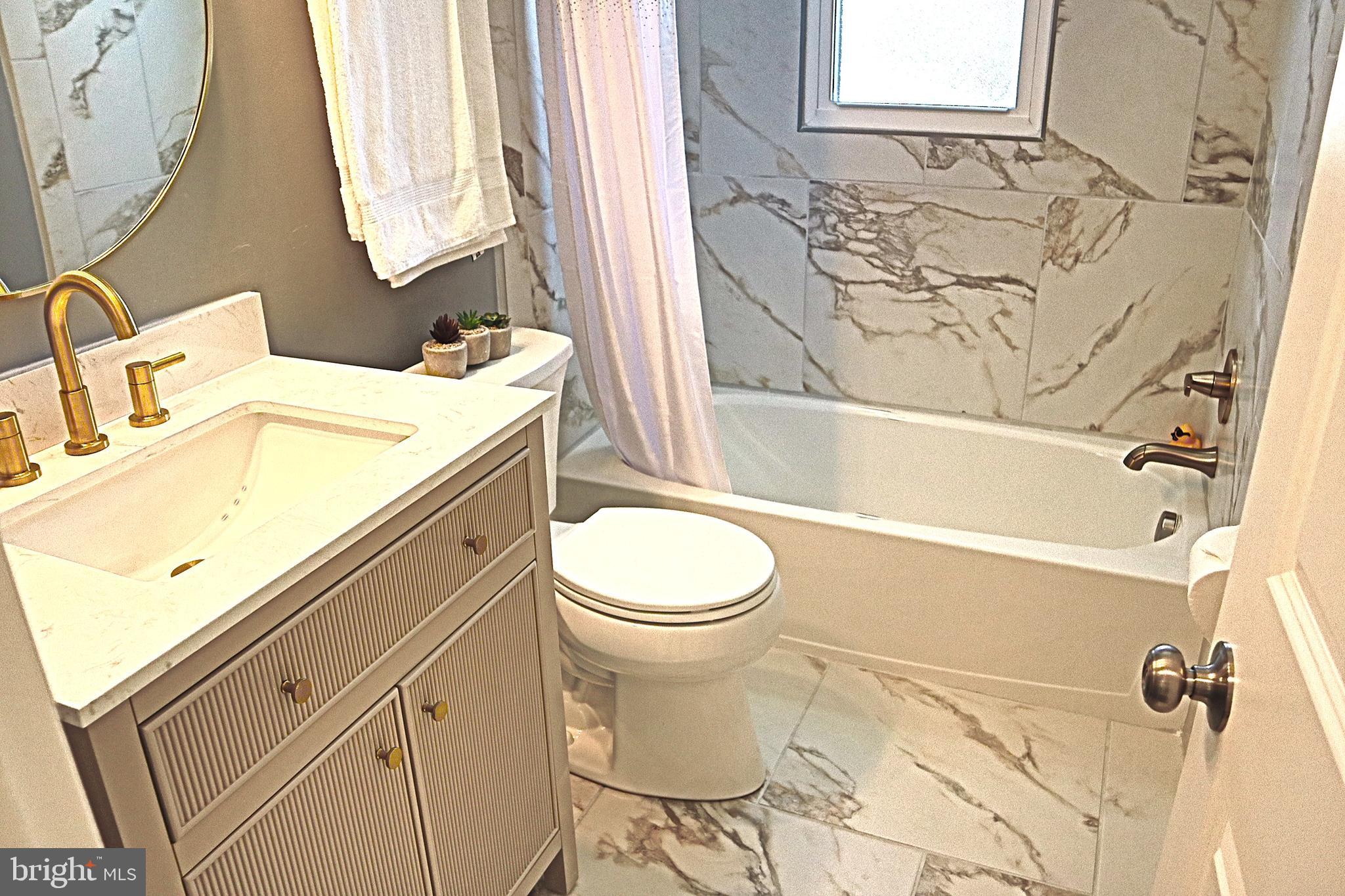 10110 Dallas Avenue Silver Spring, MD 20901 - Photo 35 of 54 Soft warm tones, quartz and brushed brass