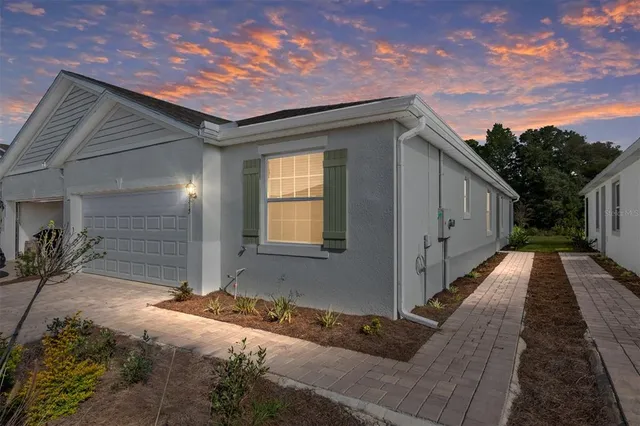 a yellow house with a outdoor space