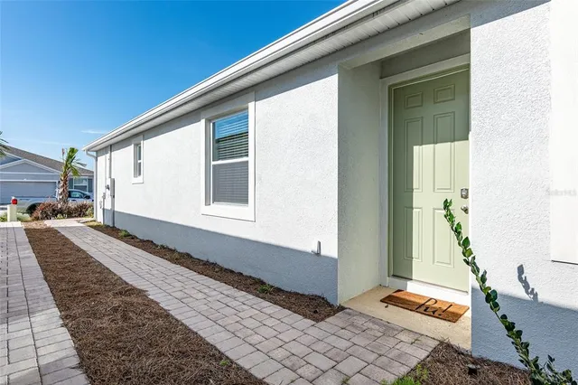 a front view of a house with a large window