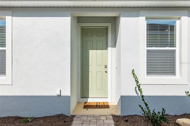 a view of a door and a window