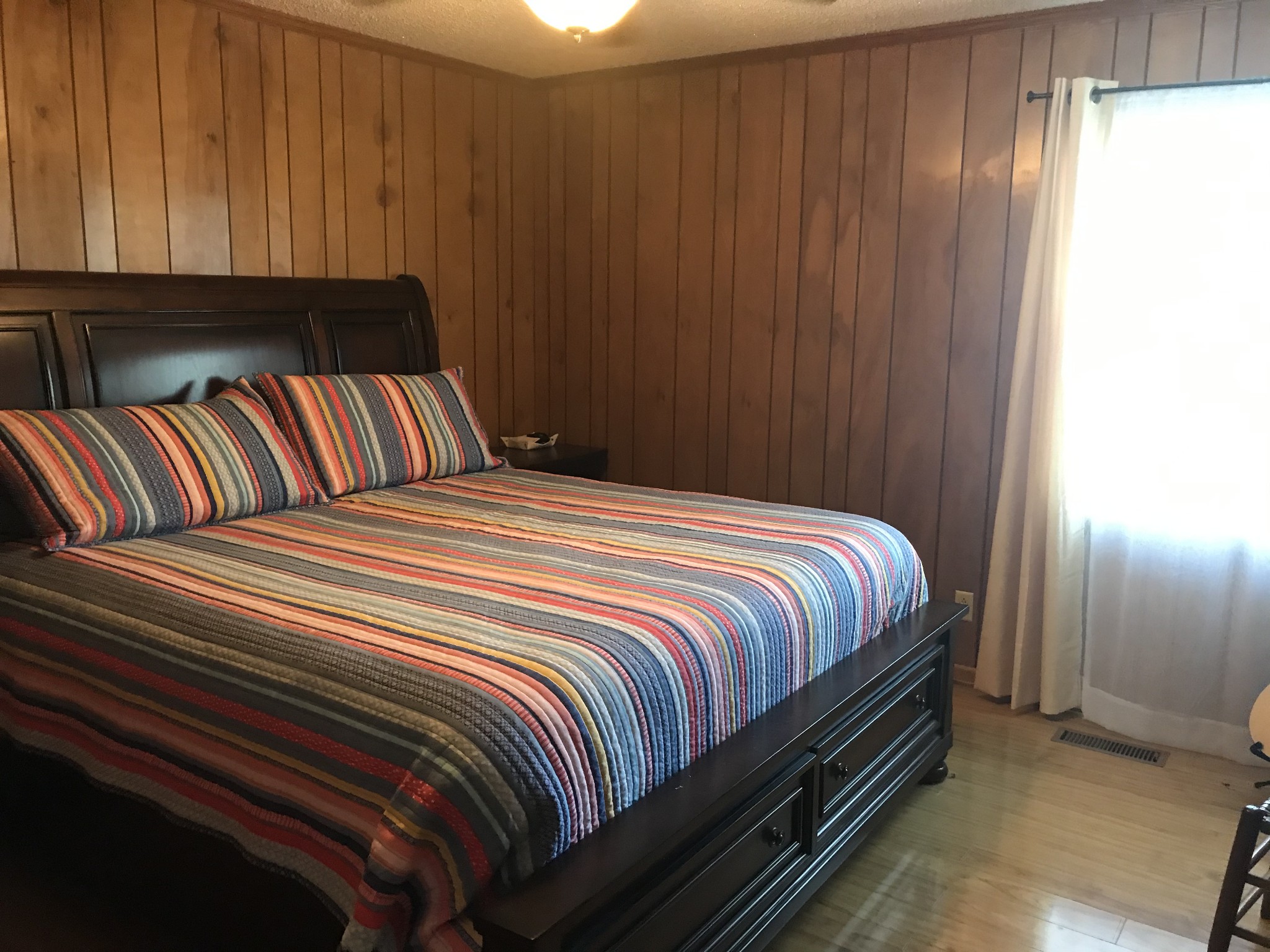 334 Little Salt Lick Road Carthage, TN 37030 - Photo 20 of 25 a bedroom with a bed and curtain