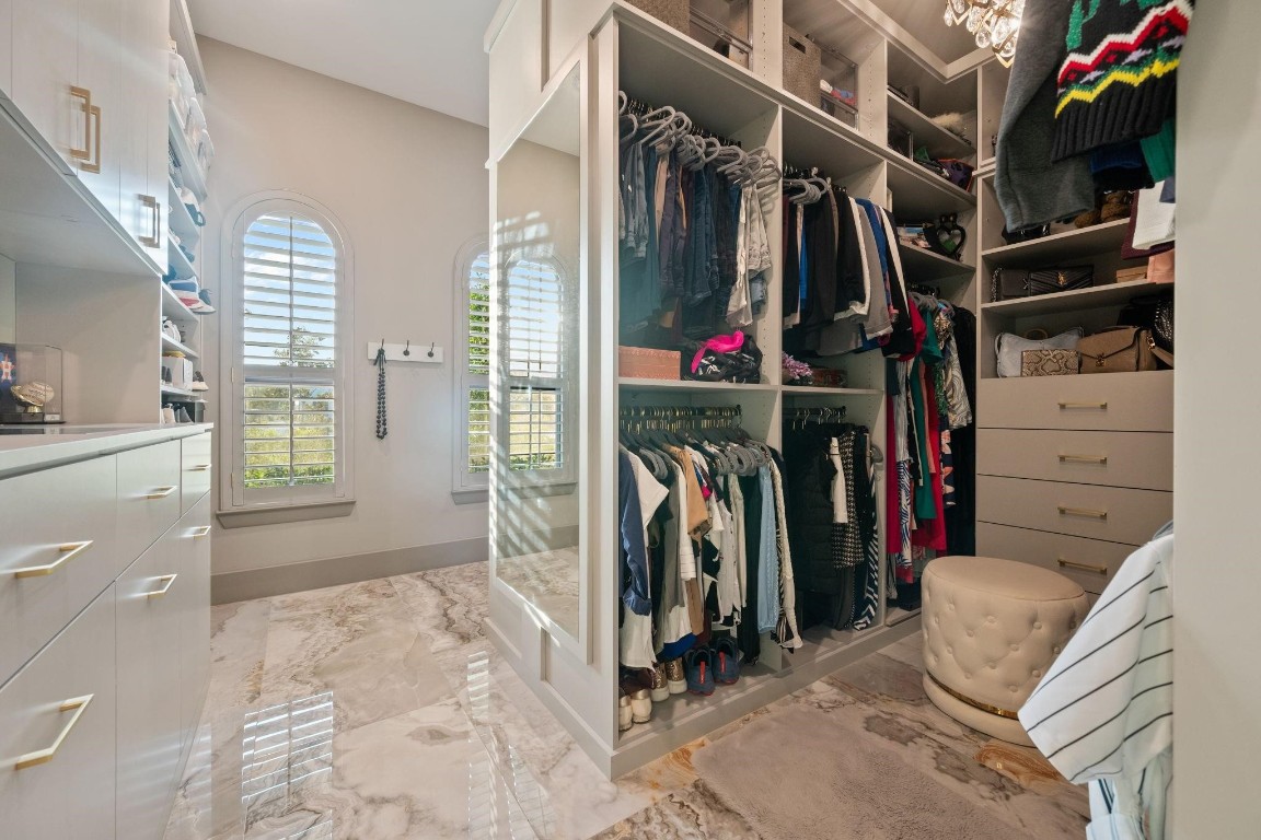 27494 South Lazy Meadow Way Spring, TX 77386 - Photo 29 of 49 a view of walk in closet with clothes and shoes