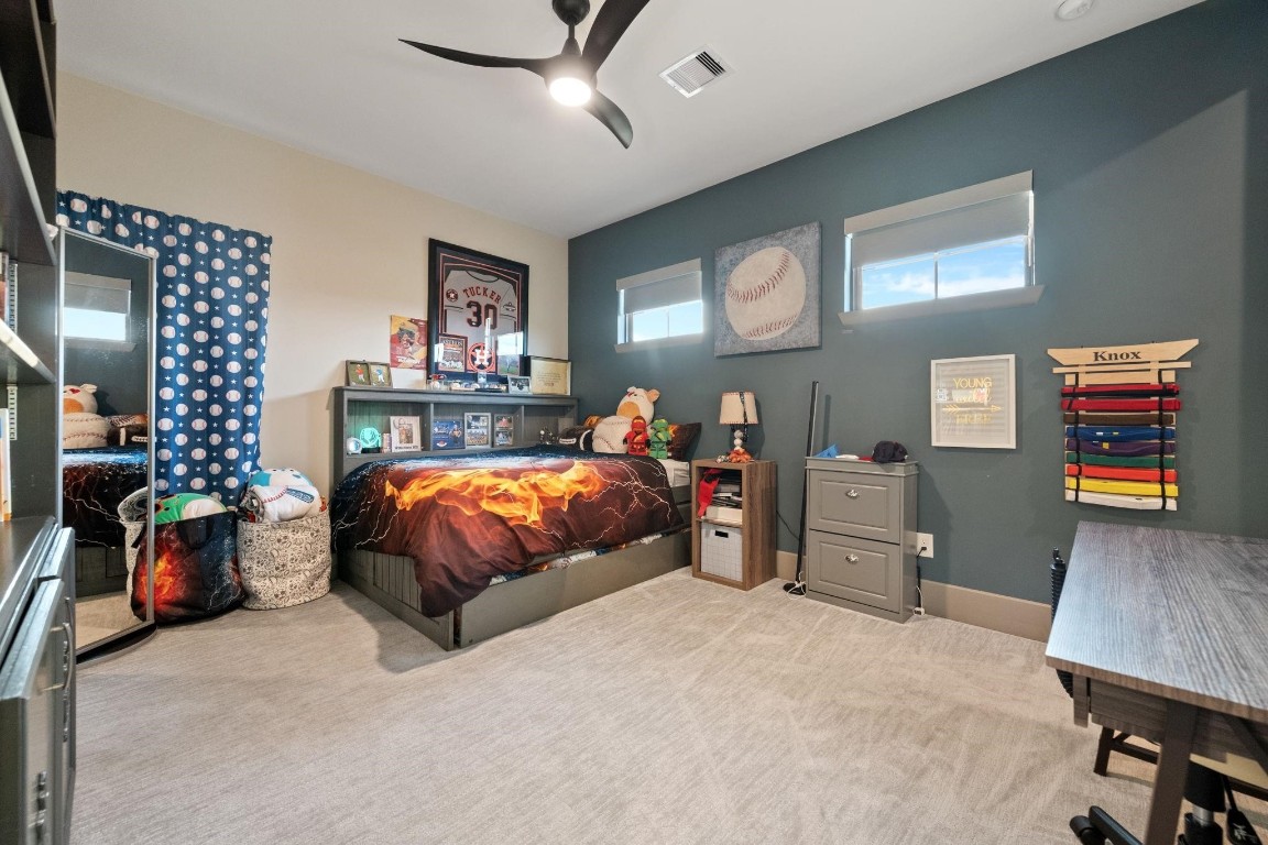 27494 South Lazy Meadow Way Spring, TX 77386 - Photo 33 of 49 a bed room with a bed and dresser