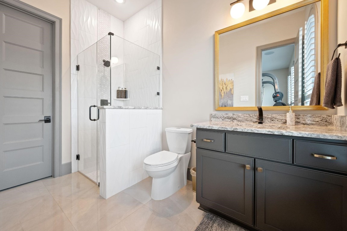 27494 South Lazy Meadow Way Spring, TX 77386 - Photo 9 of 49 a bathroom with a granite countertop sink mirror vanity and toilet