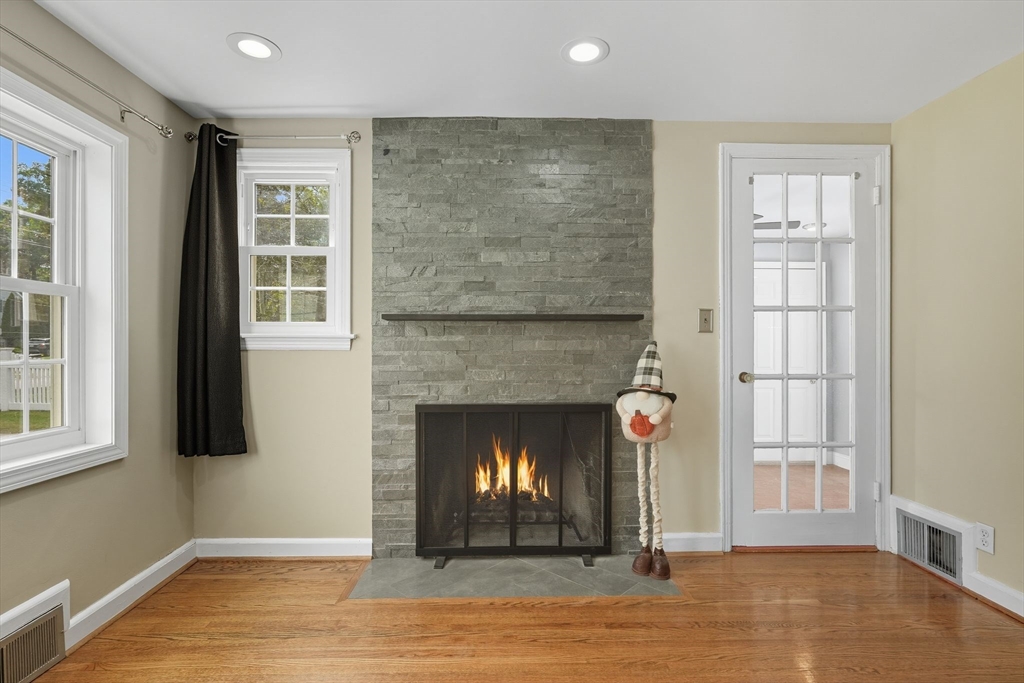 116 Hartwick Street Springfield, MA 01108 - Photo 11 of 38 an empty room with windows and fireplace