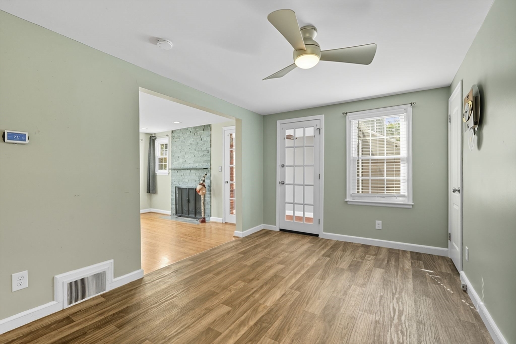 116 Hartwick Street Springfield, MA 01108 - Photo 12 of 38 a view of an empty room with wooden floor and a window