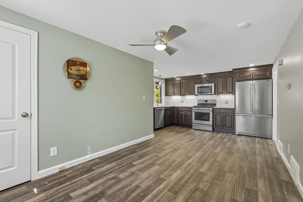116 Hartwick Street Springfield, MA 01108 - Photo 14 of 38 a kitchen with stainless steel appliances granite countertop a refrigerator a stove a sink and dishwasher