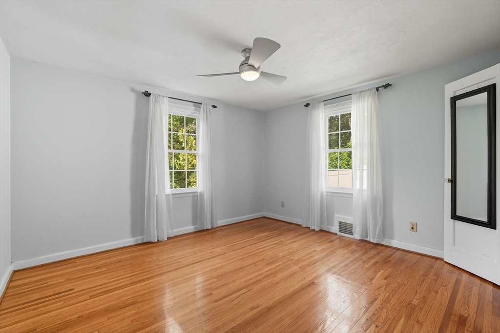 116 Hartwick Street Springfield, MA 01108 - Photo 20 of 38 a view of empty room with wooden floor and fan