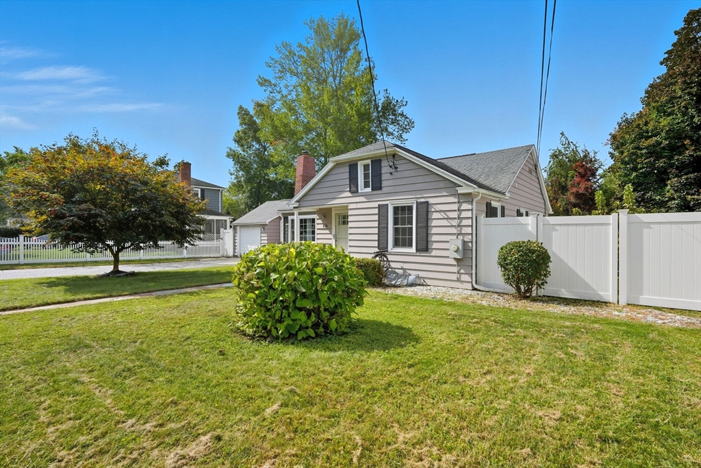 116 Hartwick Street Springfield, MA 01108 - Photo 3 of 38 a front view of a house with a yard