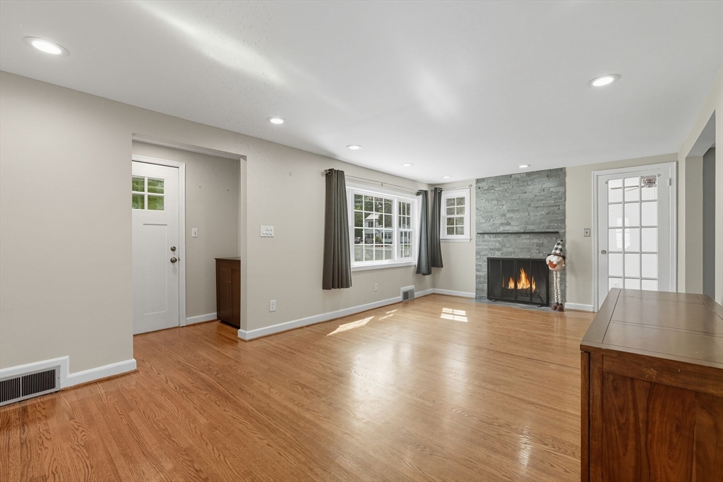116 Hartwick Street Springfield, MA 01108 - Photo 8 of 38 an empty room with windows and fireplace