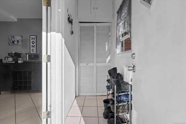 walk in closet with wooden floor