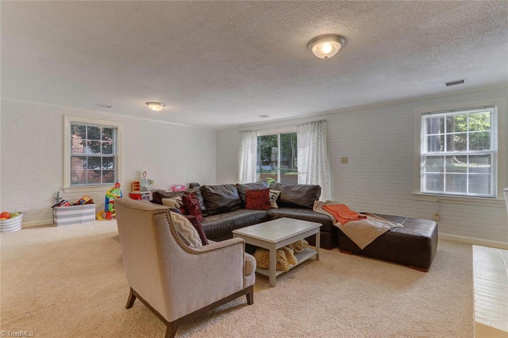 4407 Graham Road Greensboro, NC 27410 - Photo 10 of 28 WOW!!! Bonus room opens to the paved patio area! Perfect to relax and entertain!