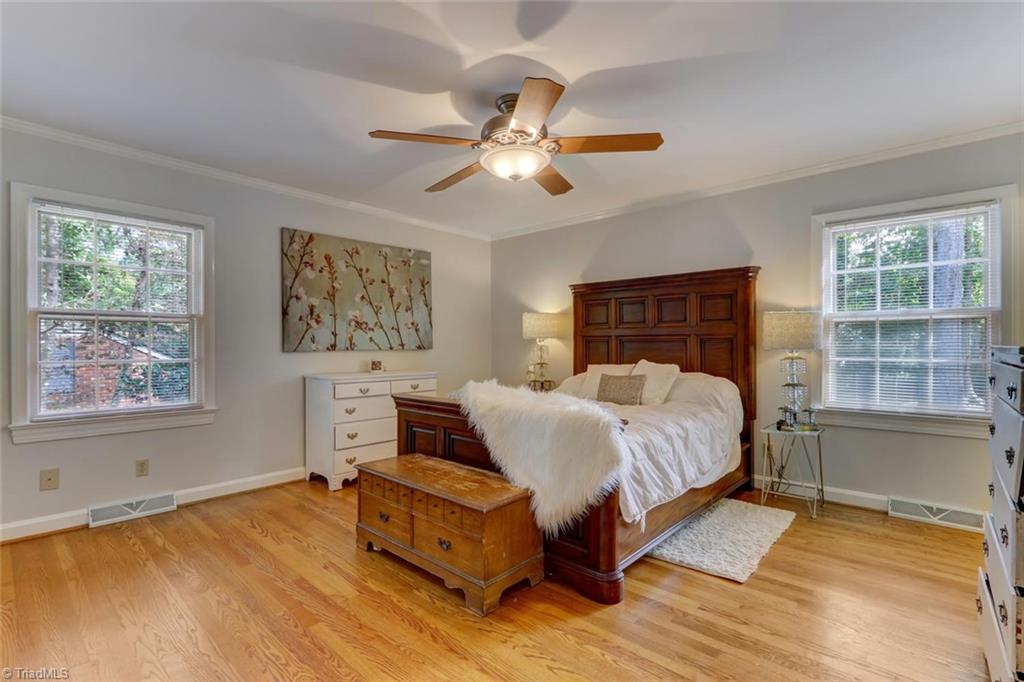4407 Graham Road Greensboro, NC 27410 - Photo 13 of 28 Spacious master bedroom with hardwood floors has been freshly painted.