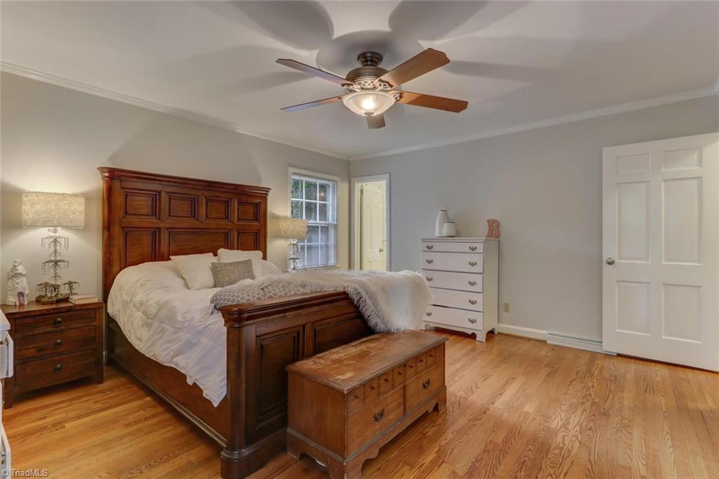 4407 Graham Road Greensboro, NC 27410 - Photo 14 of 28 The master bedroom has a private bath. The hardwood floors, crown molding, ceiling fan all accent this beautiful home.