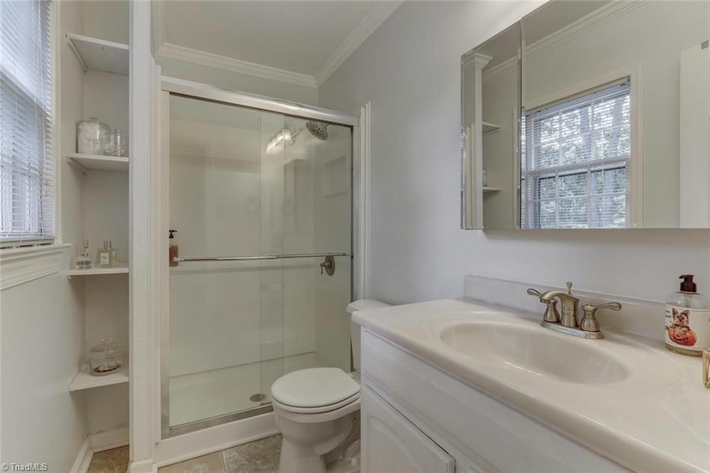 4407 Graham Road Greensboro, NC 27410 - Photo 15 of 28 The master bath has been updated with large walk-in shower.