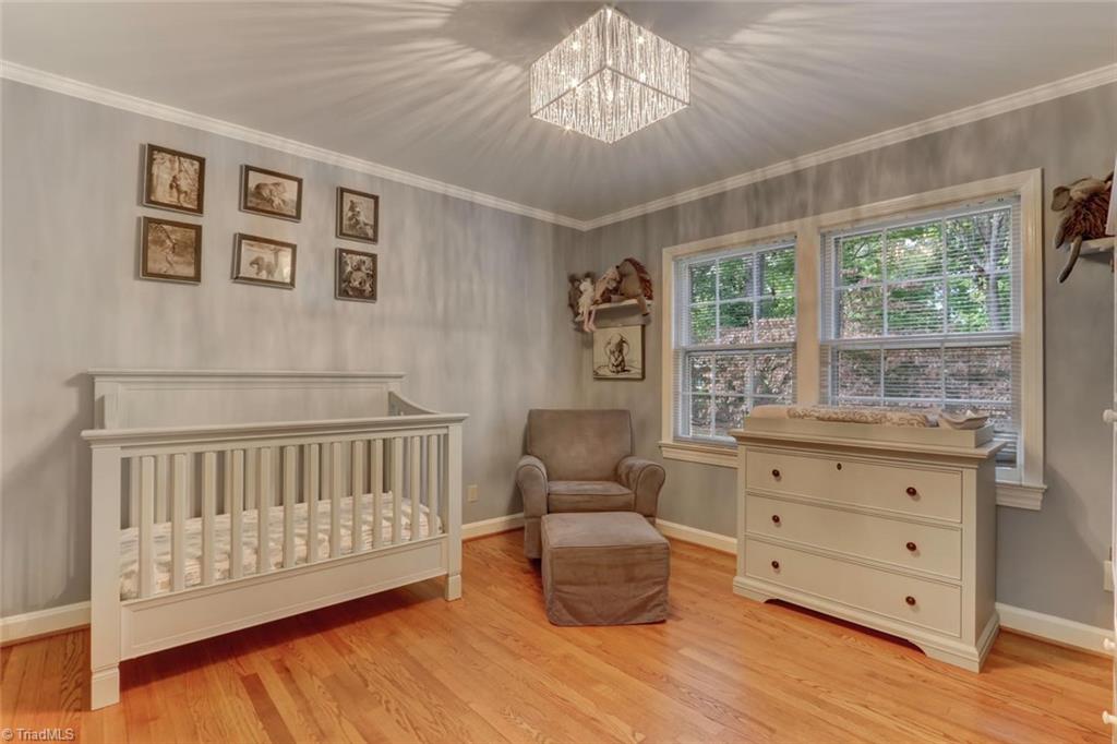 4407 Graham Road Greensboro, NC 27410 - Photo 16 of 28 WOW! Double windows to view the lovely yard and show off the beautiful hardwood floors in this upper level bedroom.