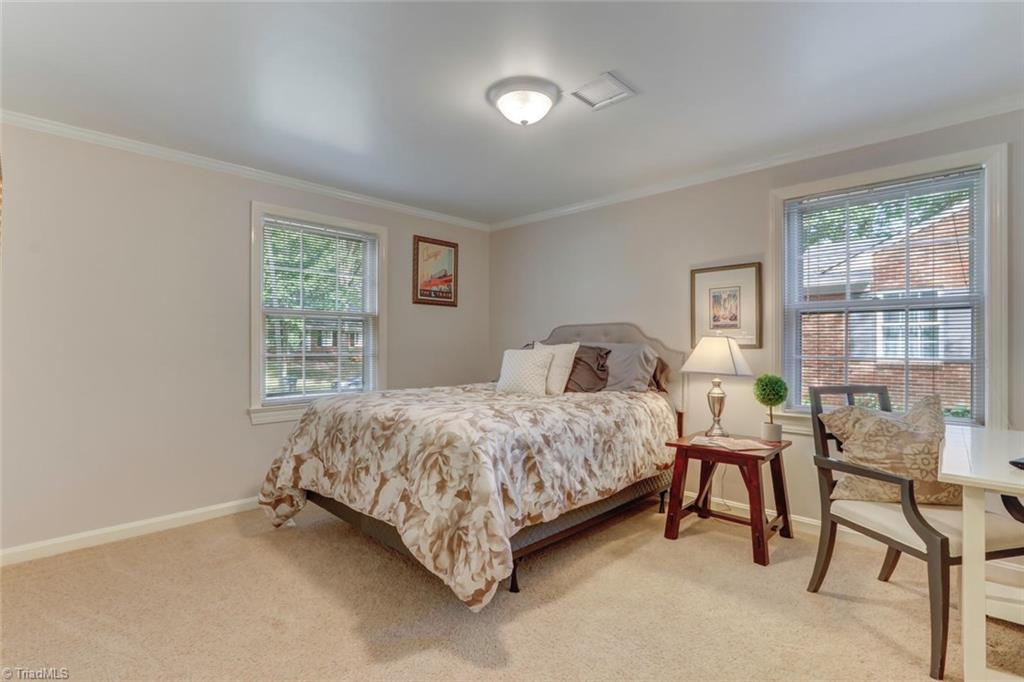 4407 Graham Road Greensboro, NC 27410 - Photo 19 of 28 This lower level 4th bedroom is perfect as and in-law suite or guest bedroom. Could be used in multiple ways!