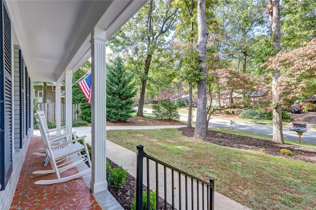 4407 Graham Road Greensboro, NC 27410 - Photo 3 of 28 The rocking chair front porch is perfect to relax while waving to friends walking by.