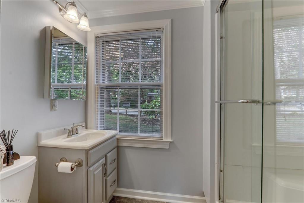 4407 Graham Road Greensboro, NC 27410 - Photo 20 of 28 Fantastic lower level full bath as been updated with walk-in shower!