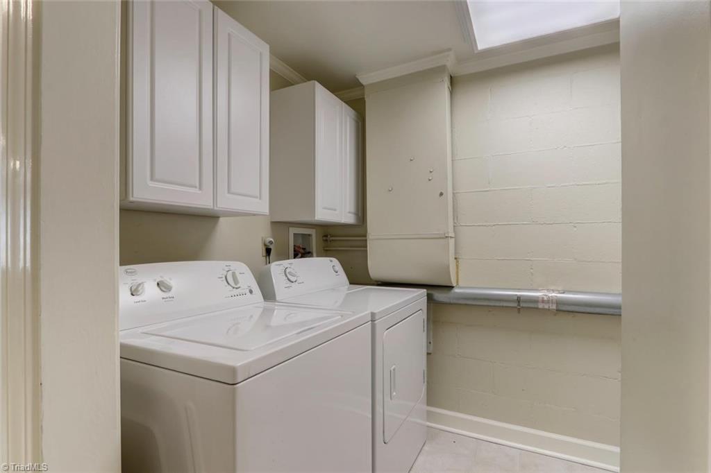 4407 Graham Road Greensboro, NC 27410 - Photo 21 of 28 Gracious space in the laundry room with storage!