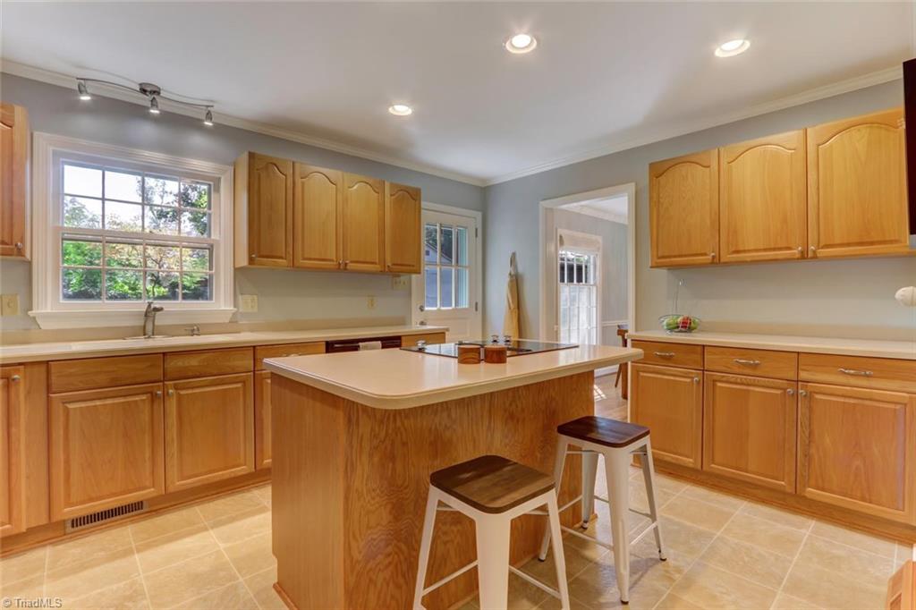 4407 Graham Road Greensboro, NC 27410 - Photo 7 of 28 Wonderful storage and counter space in the kitchen!