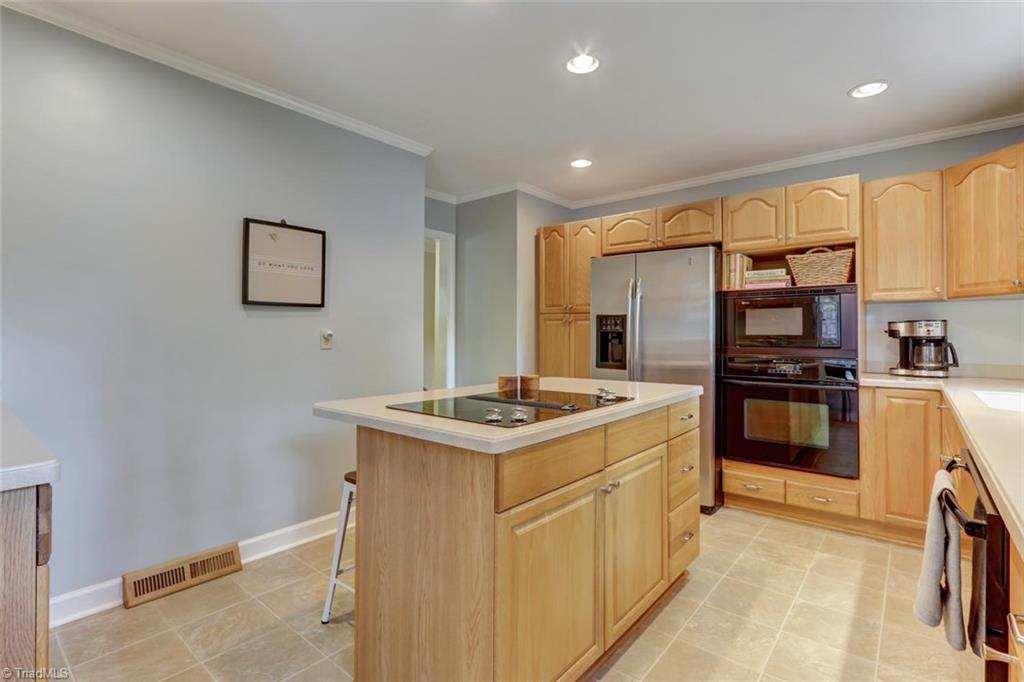 4407 Graham Road Greensboro, NC 27410 - Photo 8 of 28 Built-in oven and pantry! Recessed lighting and fantastic natural light!