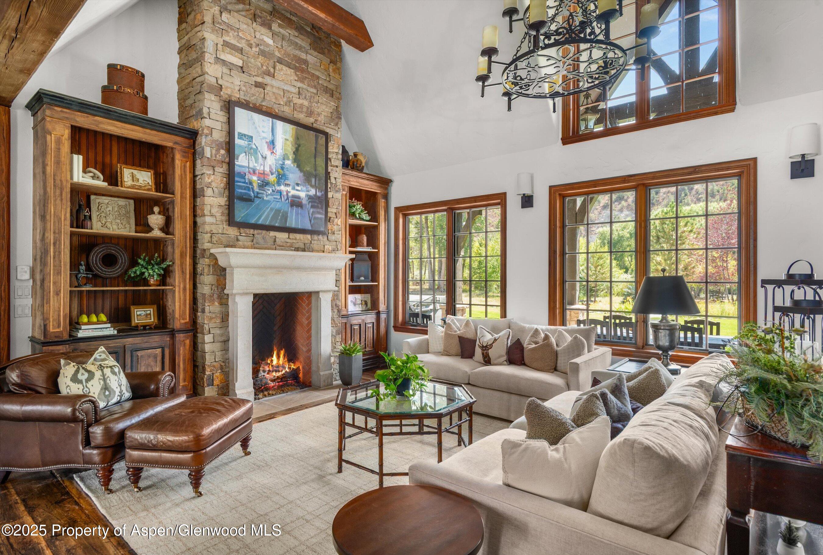 16 St Finnbar Farm Road Carbondale, CO 81623 - Photo 11 of 51 a living room with furniture fireplace and floor to ceiling windows