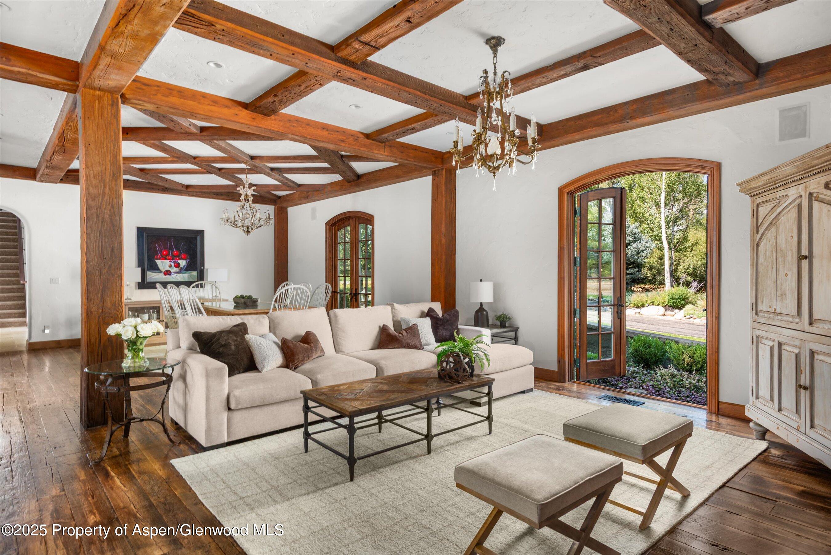 16 St Finnbar Farm Road Carbondale, CO 81623 - Photo 15 of 51 a living room with furniture and a chandelier