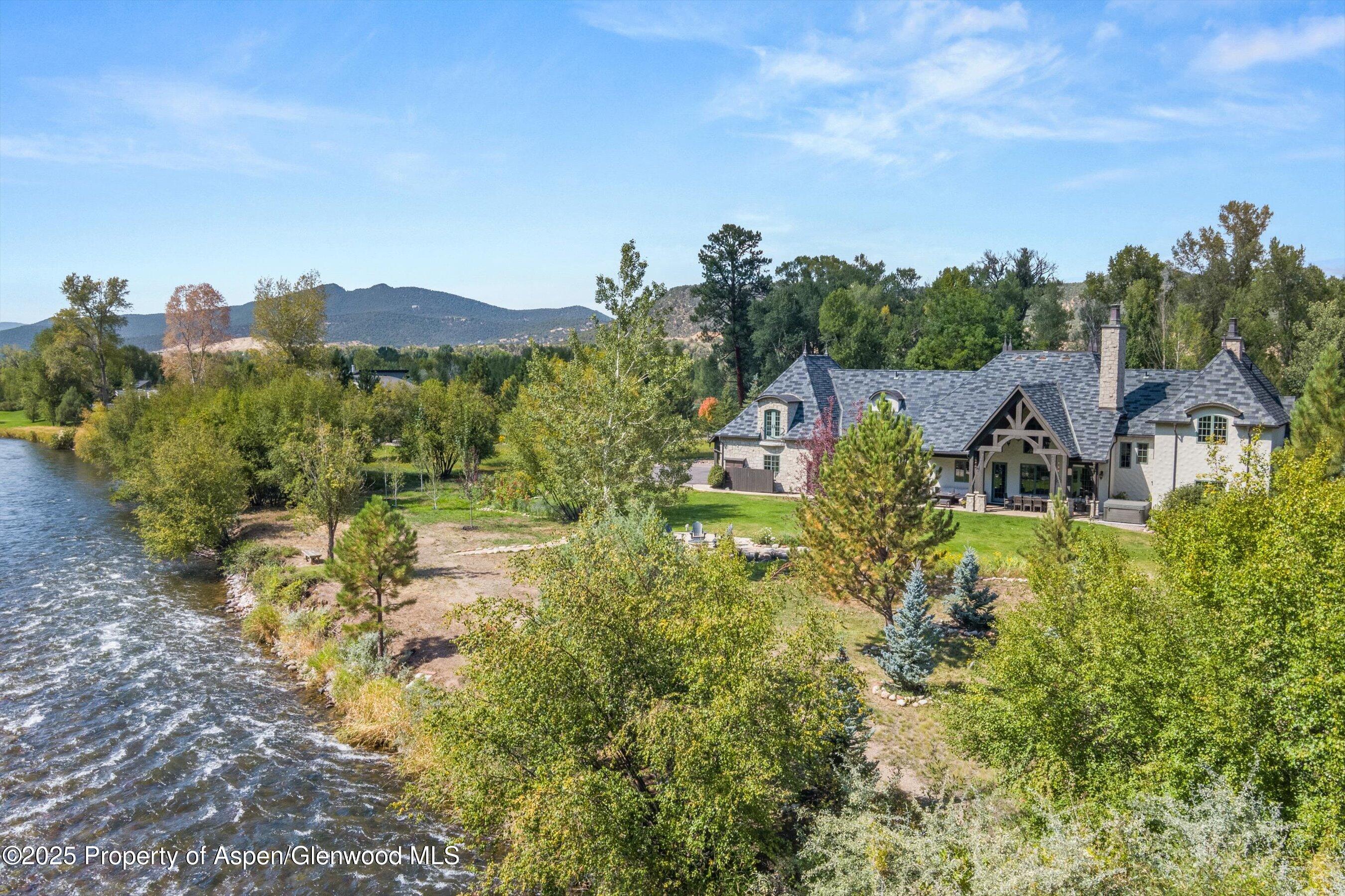 16 St Finnbar Farm Road Carbondale, CO 81623 - Photo 2 of 51 a view of a garden with a building in the background