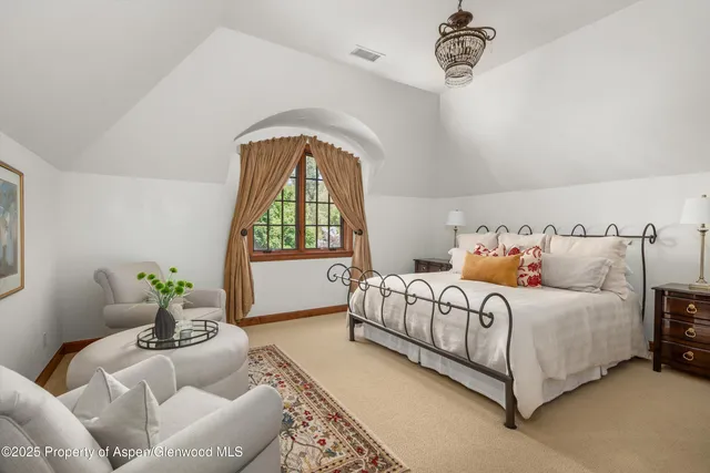 a bathroom with a double vanity sink mirror and shower