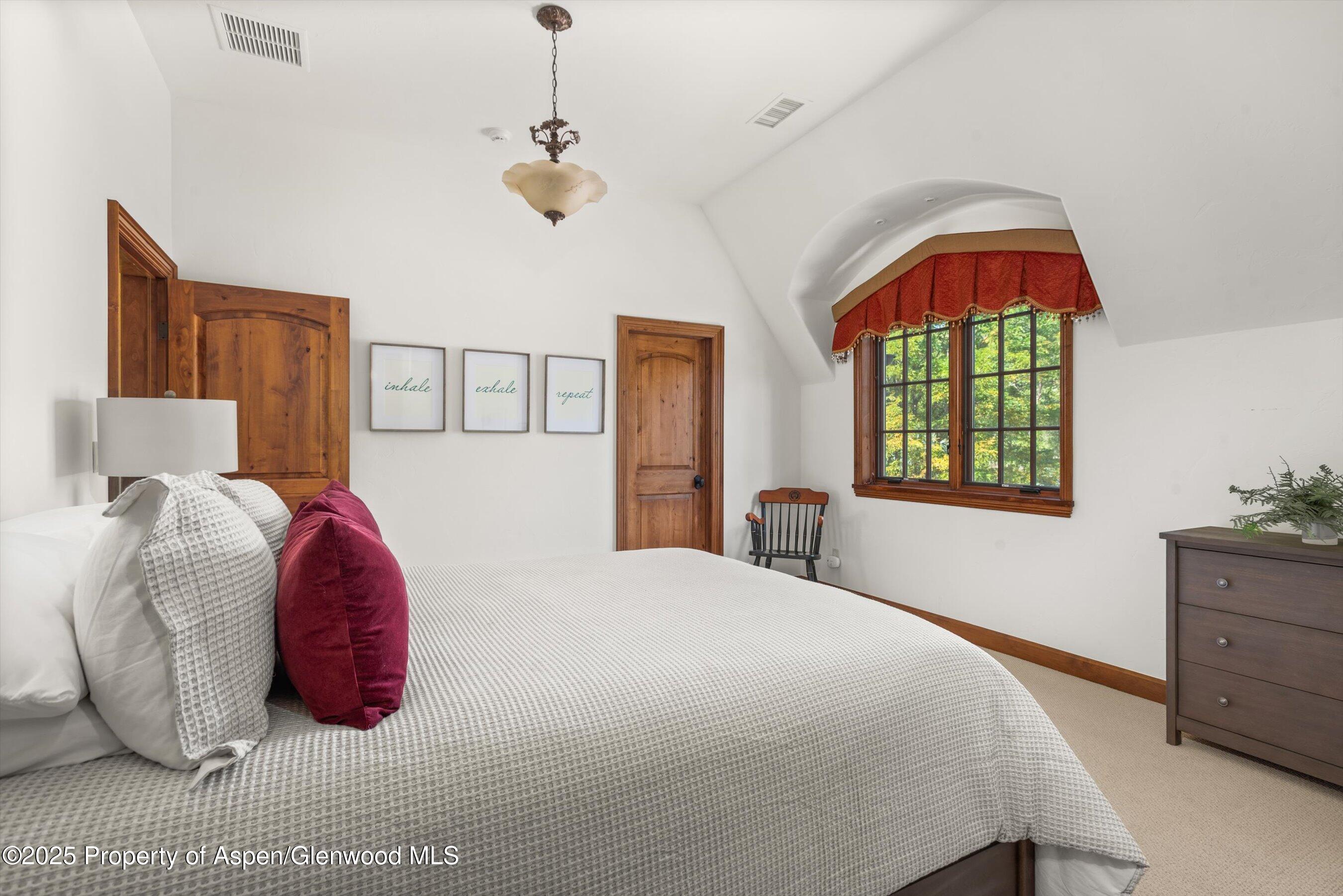 16 St Finnbar Farm Road Carbondale, CO 81623 - Photo 30 of 51 a bedroom with a bed and window