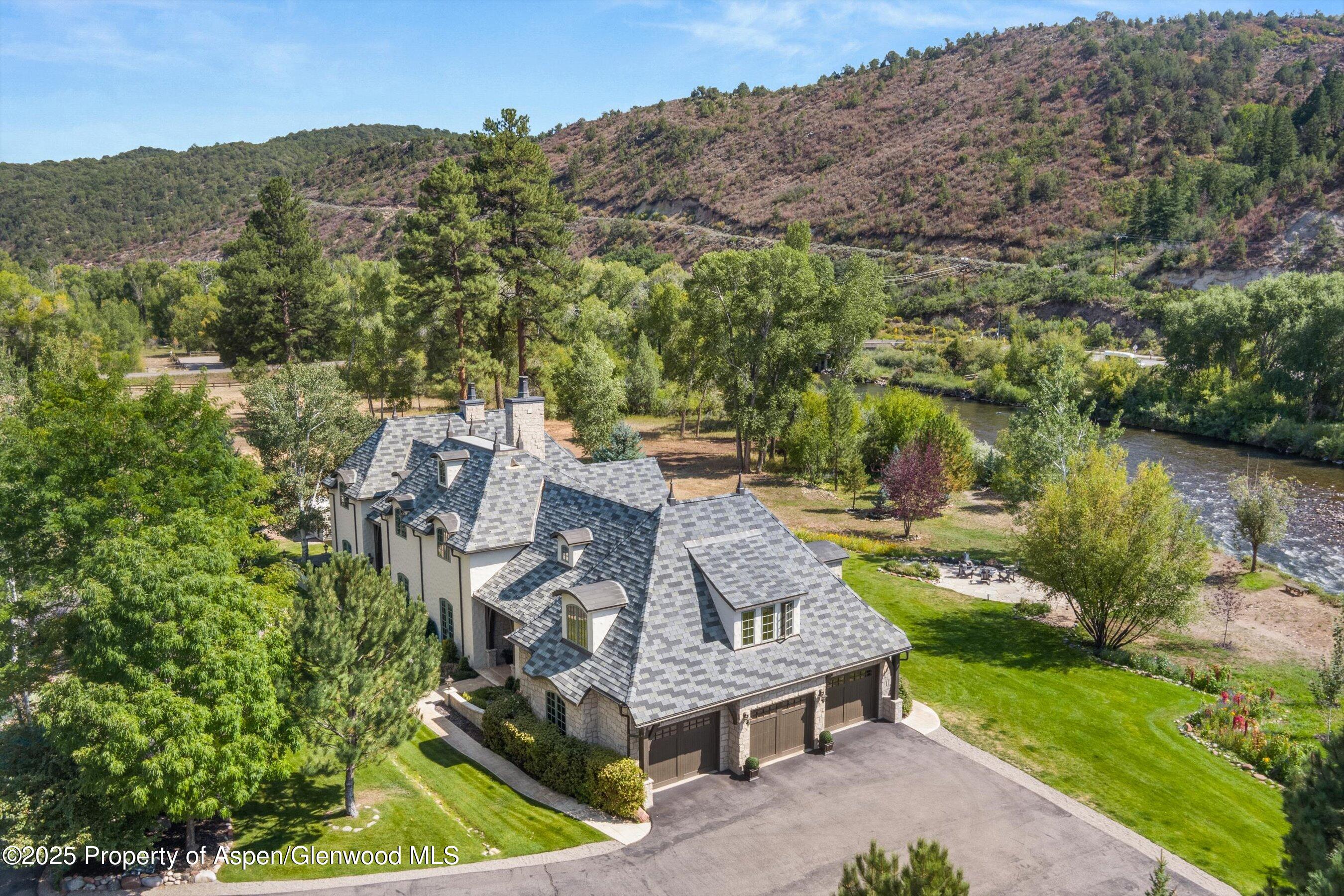 16 St Finnbar Farm Road Carbondale, CO 81623 - Photo 49 of 51 an aerial view of a house with a garden and lake view