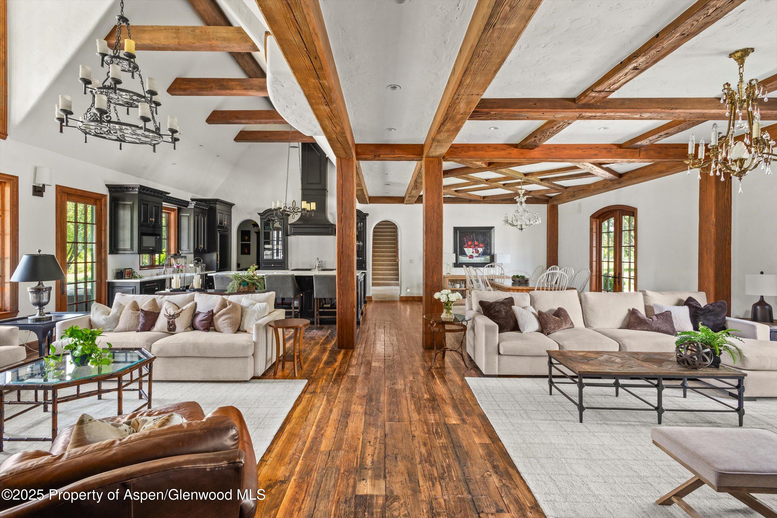 16 St Finnbar Farm Road Carbondale, CO 81623 - Photo 10 of 51 a living room with furniture and a chandelier